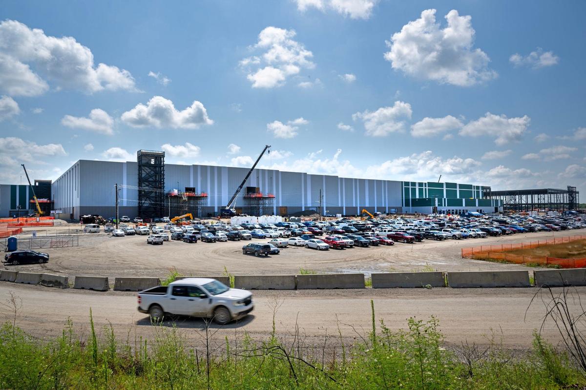 Some parts of the massive plan are complete and manufacturing equipment has already been moved into place.