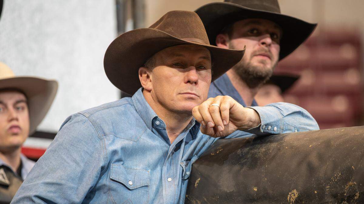 Kansas City Outlaws coach J.W. Hart observes the competition during the first round of the PBR Pendleton Whisky Velocity Tour event in North Charleston, S.C.