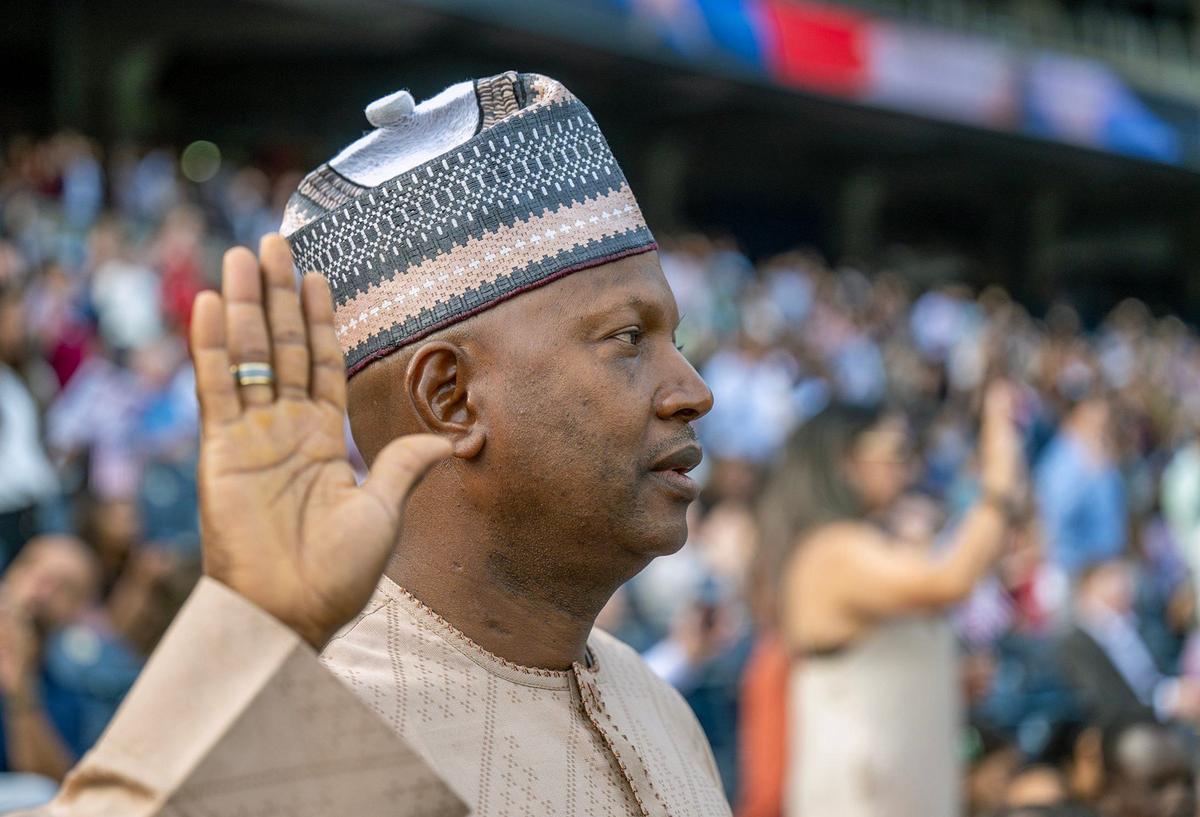 Abubakar Karaye, a native of Nigeria, takes the Oath of Allegiance Thursday. Karaye is a transportation associate living in Belton, Missouri.