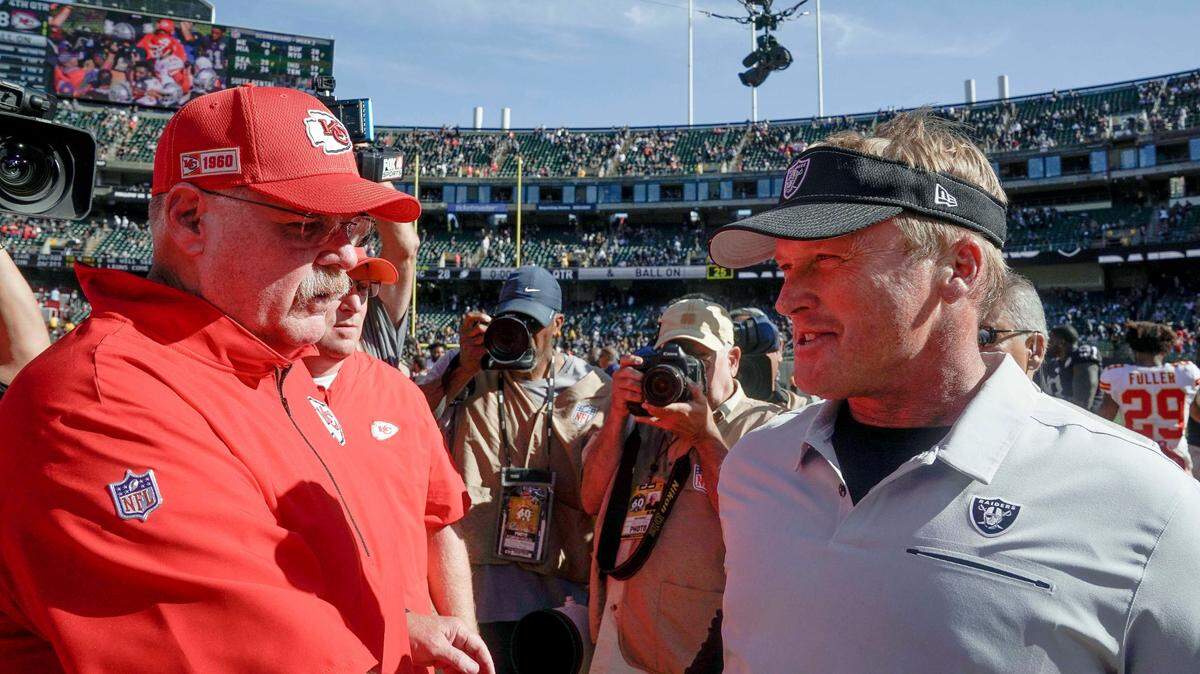 Kansas City Chiefs head coach Andy Reid and Oakland Raiders head coach Jon Gruden meet after a game at the Oakland Coliseum. 
