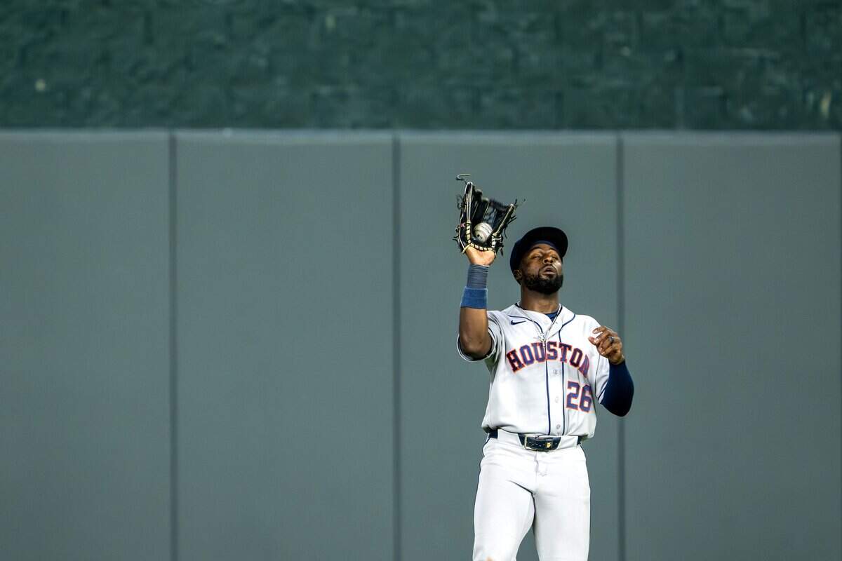 Houston Astros center fielder Taylor Trammell (26) catches a fly ball in the seventh inning during a game against the Kansas City Royals on Friday, June 12, 2026, at Kauffman Stadium in Kansas City.