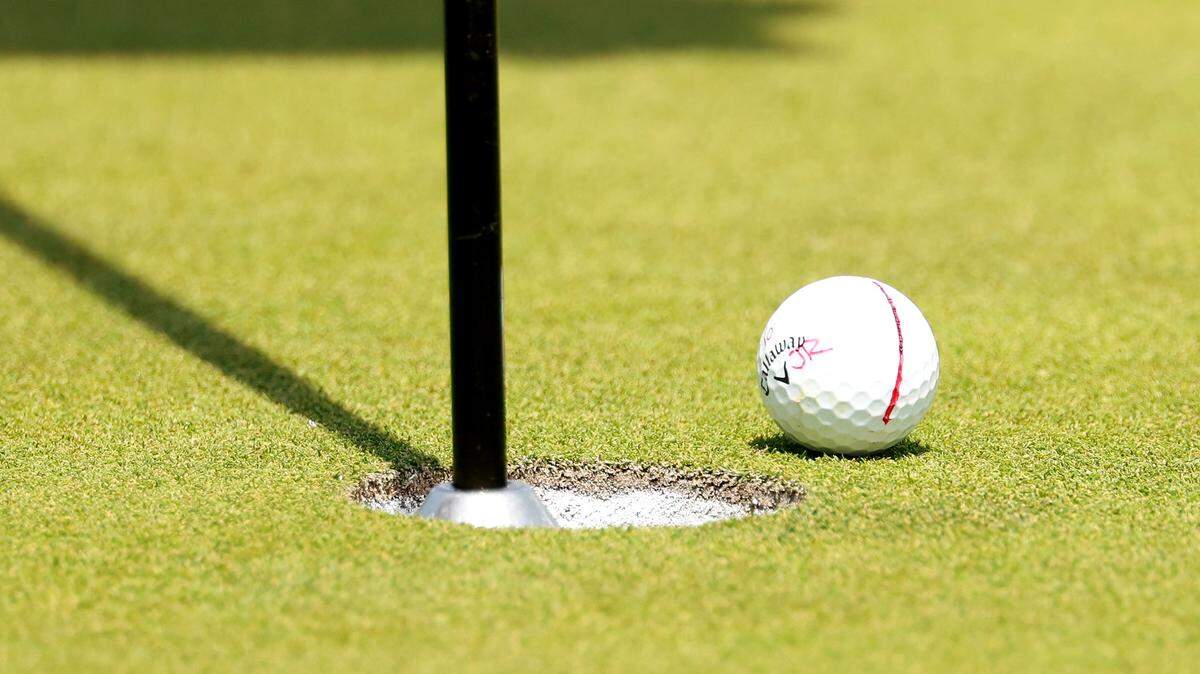 A detailed view of a golf ball on the 15th green on Day 3 of LIV Golf Indianapolis at The Club at Chatham Hills on August 17, 2025 in Westfield, Indiana.