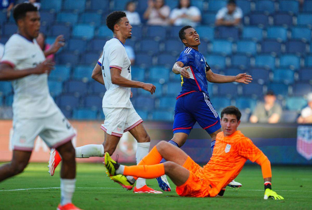 Japan midfielder Joel Chima Fujita (8) reacts after a shot on goal against United States defender Jonathan Tomkinson (4) and goalkeeper Patrick Schulte (1) during the first half at Children’s Mercy Park on June 11, 2024.