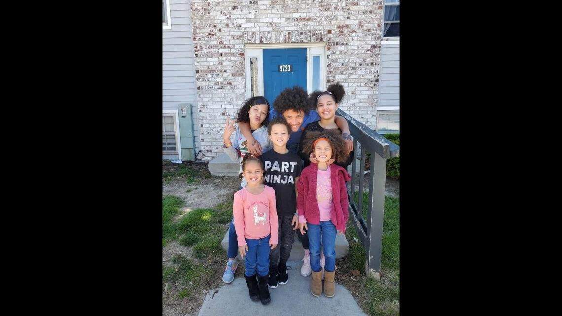 Jaden smiles for a picture with his younger siblings. Louise Terry