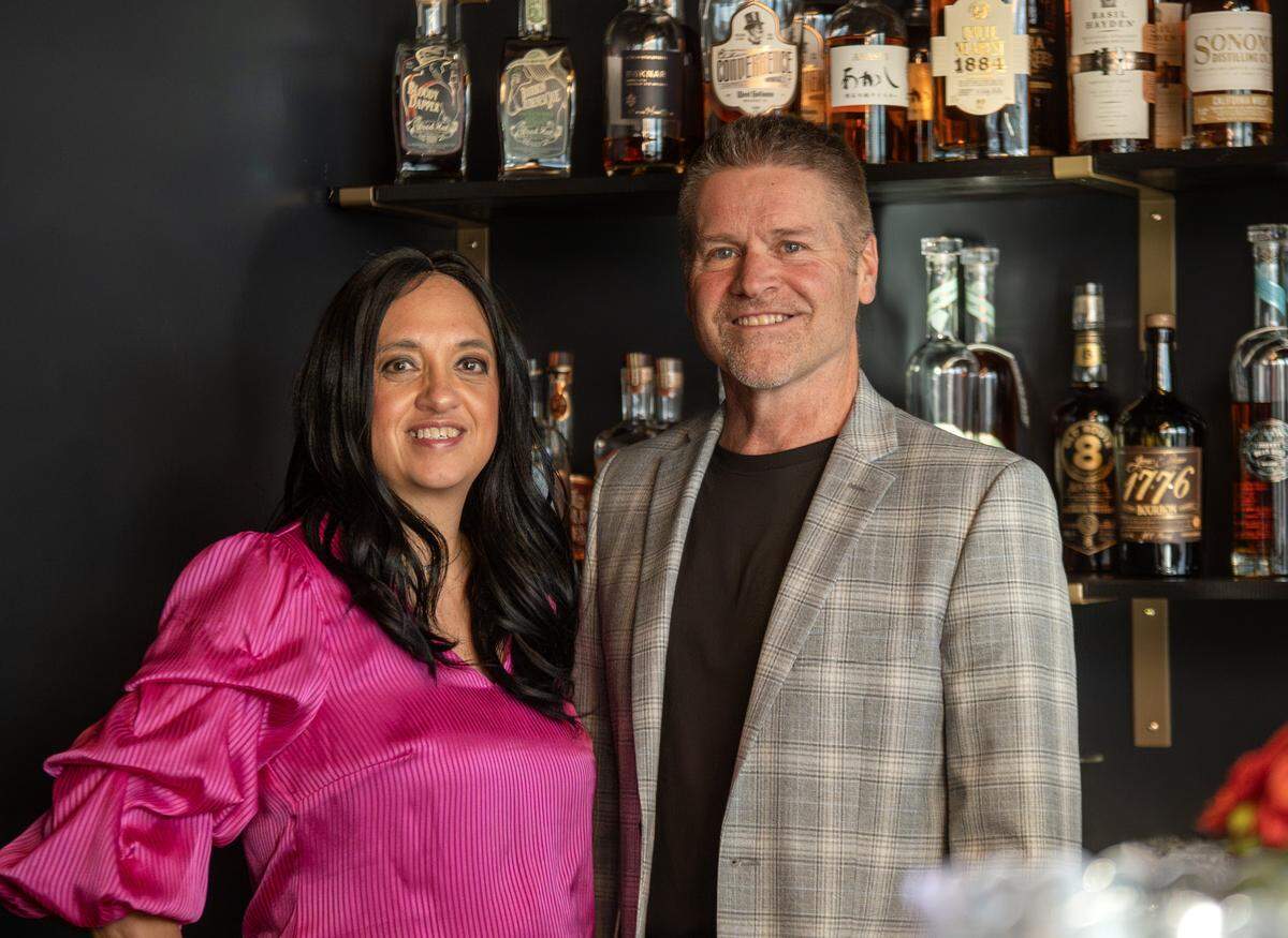 Laura, left, and Howard Turley, owners of Audrey's Wine + Bourbon, stand for a portrait on Thursday, Feb. 5, 2026, in the Waldo neighborhood of Kansas City.