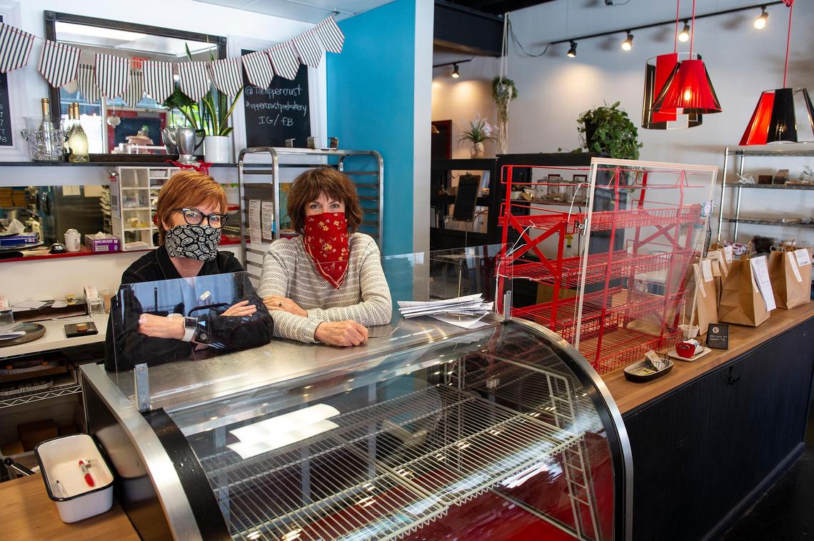 Elaine Van Buskirk, left, and her sister Jan Knobel decided to close the Upper Crust Pie Bakery in downtown Overland Park. They could have kept it open since they sell food but decided to support the stay-at-home order.