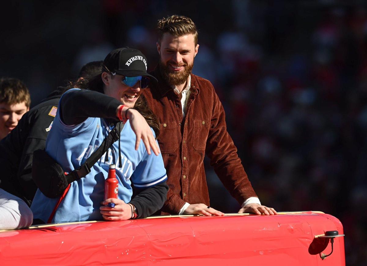 Kansas City Chiefs punter Tommy Townsend, left, and place kicker Harrison Butker ride on a bus during the Kansas City Chiefs Super Bowl LVIII victory parade Wednesday, Feb. 14, 2024, in Kansas City.
