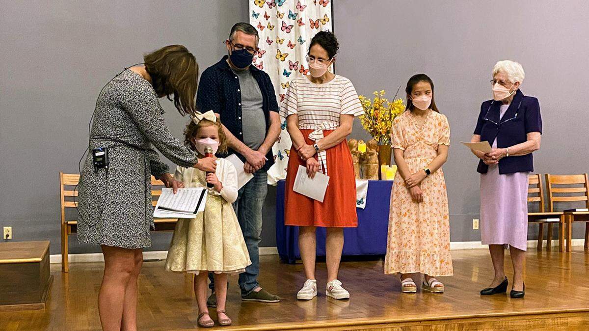 Simone Pauls with her parents Brian and Nikki Pauls, sister Yiyi and her grandmother visiting KCK's Rainbow Mennonite Church from central Kansas.