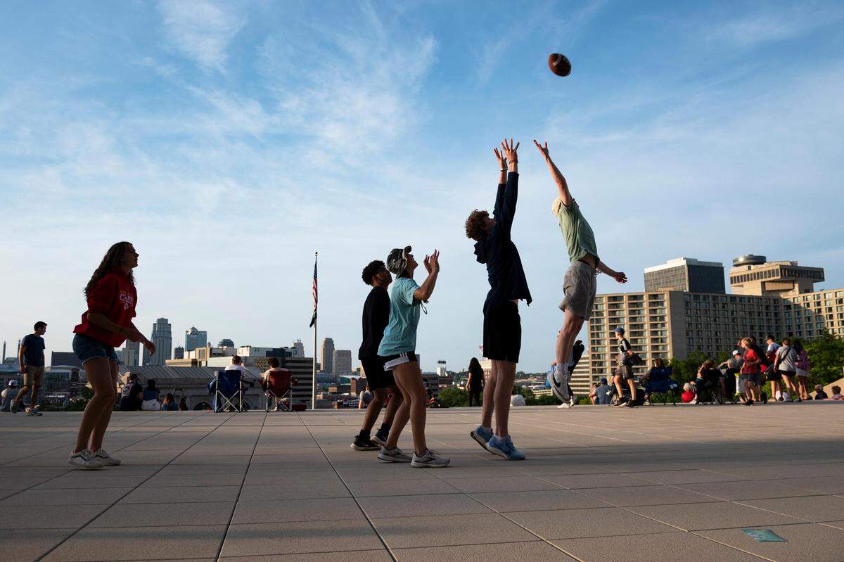 Kids play just beneath the National WWI Museum and Memorial before the Celebration at the Station, an event featuring the Kansas City Symphony, on Sunday, May 29, 2022, in Kansas City.