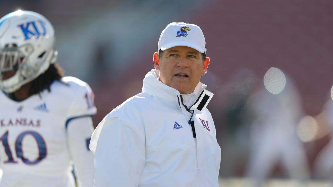 Kansas head coach Les Miles watches warm-ups before an NCAA college football game against Iowa State, Saturday, Nov. 23, 2019, in Ames, Iowa.