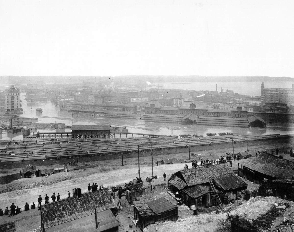 Observers in Missouri survey flooding of the Kansas River, 1903.