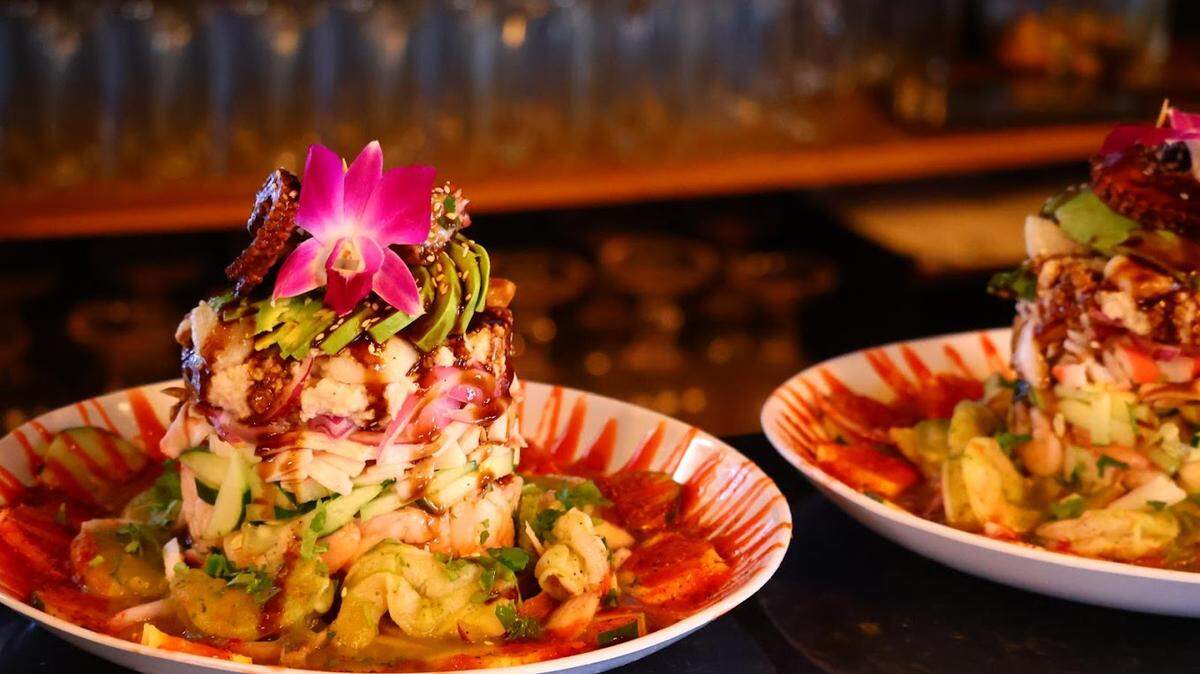 The seafood tower at Playa & Mezcal has shrimp, octopus, scallops, surimi, pico de gallo, red onions and sauce.