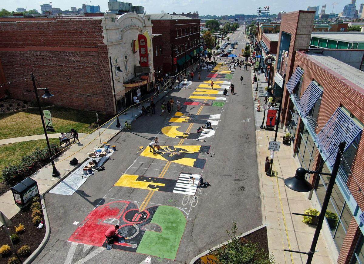 Volunteers paint the Black Lives Matter mural at the 18th and Vine Jazz District Saturday, Sept. 5, 2020. It is one of six being painted around Kansas City.