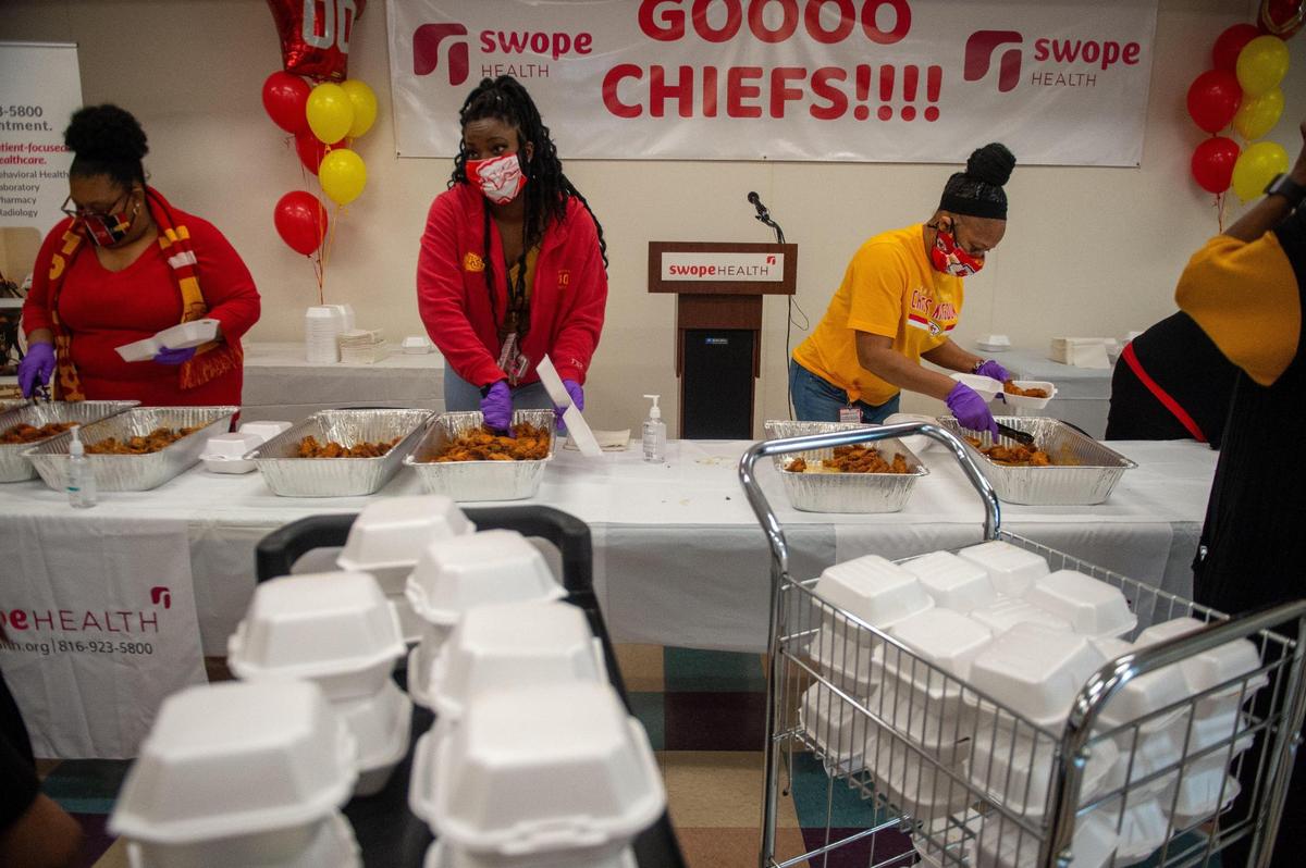 Swope Health Services staff packed Buffalo wings in boxes to deliver to employees Wednesday.