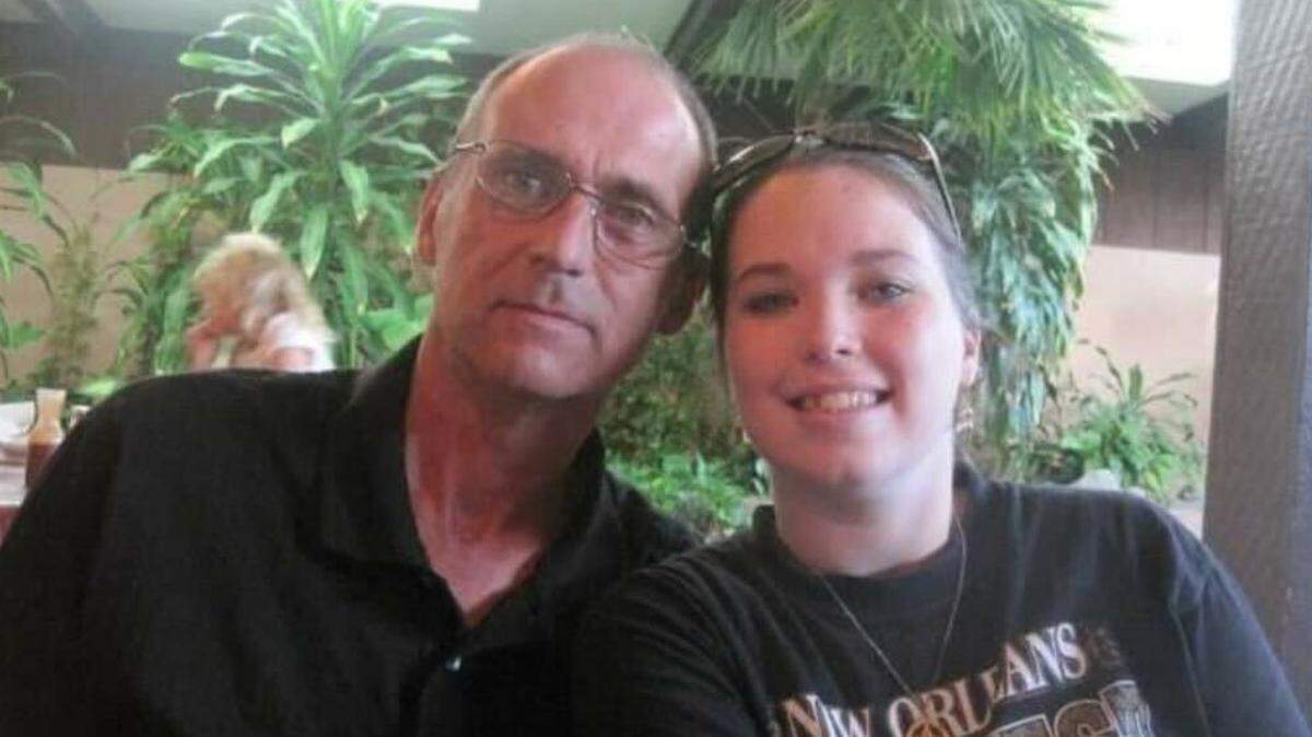 James Perry poses with his daughter, Brittany Goldman. Goldman says Perry was a devoted father who loved his family.