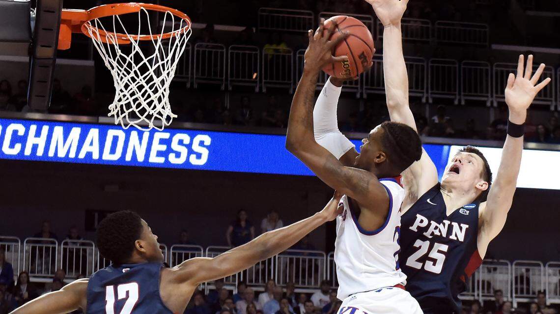 KU's Lagerald Vick, who had 14 points in the Jayhawks' win, shoots over Penn's Devon Goodman (12) and AJ Brodeur during the second half of Thursday's game in Wichita.