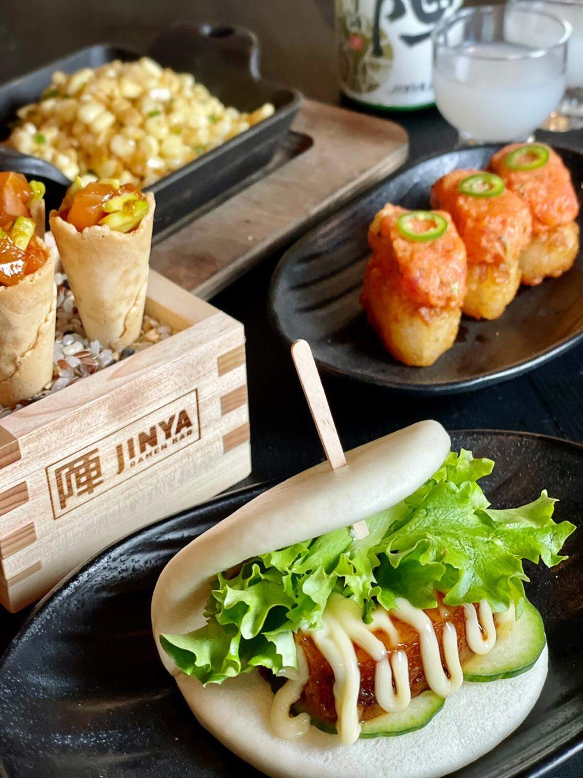 Jinya small plates, from bottom clockwise: Jinya bun, spicy tuna and salmon cones, jalapeno corn and crispy rice with spicy tuna.