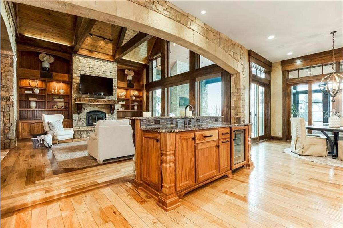 The main floor inside 27409 W. 108th St. in Olathe is open flooring, flowing from the kitchen to the living room.