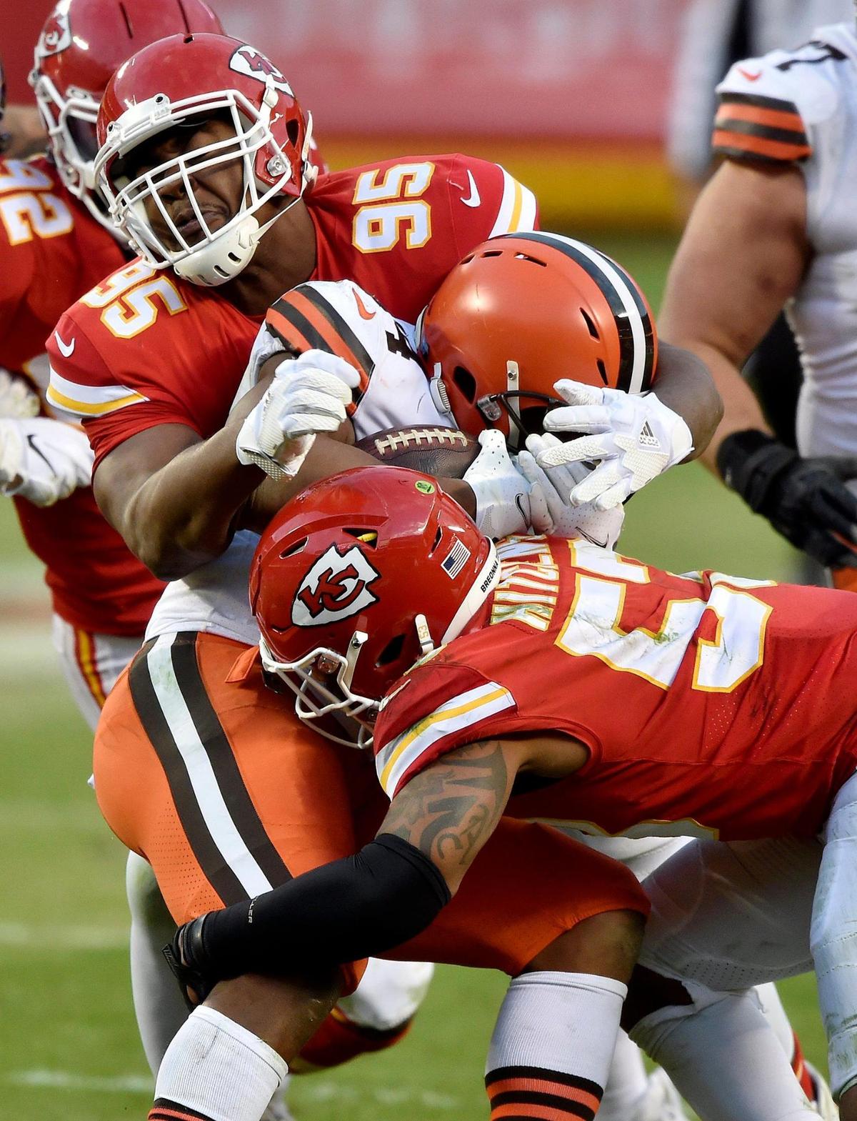 Kansas City Chiefs defensive tackle Chris Jones (95) and middle linebacker Anthony Hitchens tackle Cleveland Browns running back Nick Chubb for no gain in the fourth quarter of the AFC Divisional Playoff game between the Chiefs and the Cleveland Browns at Arrowhead Stadium Sunday, Jan. 17, 2021. The Chiefs defeated the Browns 22-17.