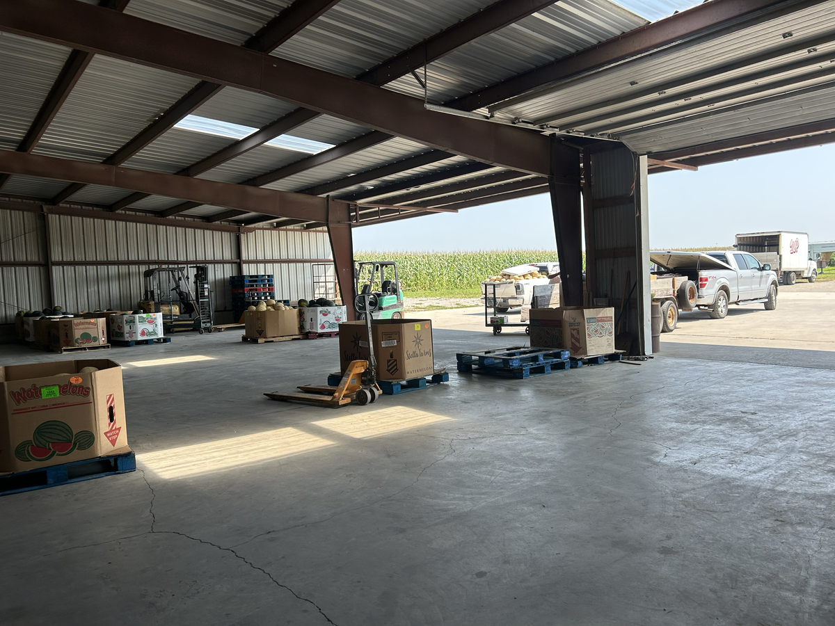 After two and a half hours, the auction floor is empty, and people tote away their produce to their cars and horses and buggies.