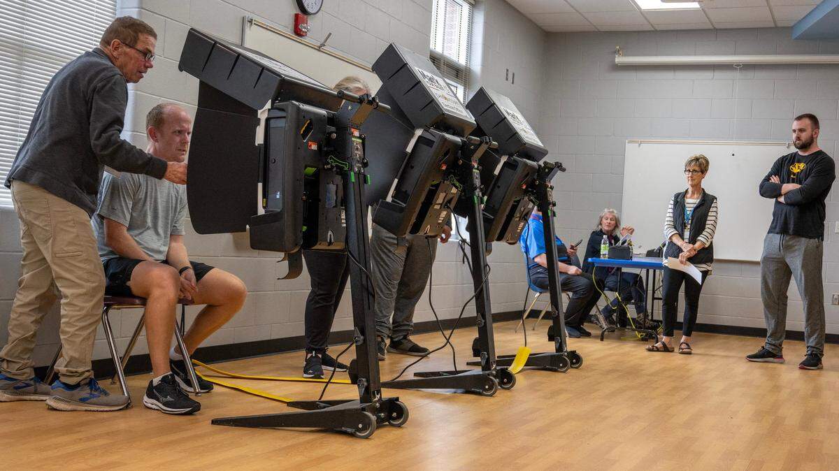 Voters cast their ballots at Blue Valley Recreation Center in Overland Park on Tuesday, Nov. 7, 2023.