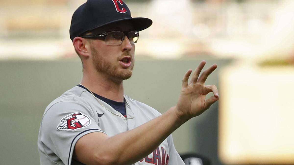 Cleveland Guardians starting pitcher Tanner Bibee (61) questions the umpire on the number of strikes against Minnesota Twins third baseman Royce Lewis (not pictured) were assessed in the fourth inning at Target Field. After the umpires conferred, Lewis was called out on strikes.