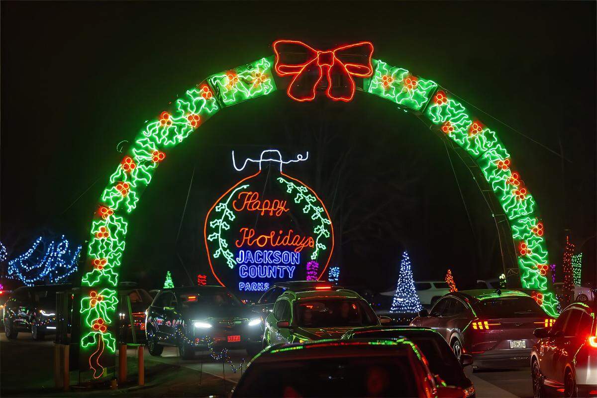 Vehicles snake through Christmas in the Park, a huge, free drive-thru light show on Wednesday, Dec. 10, 2025, at Longview Lake in Kansas City. The display, staged by Jackson County Parks & Rec, features more than one million lights and over 200 animated displays. It is the 38th year for the popular display.