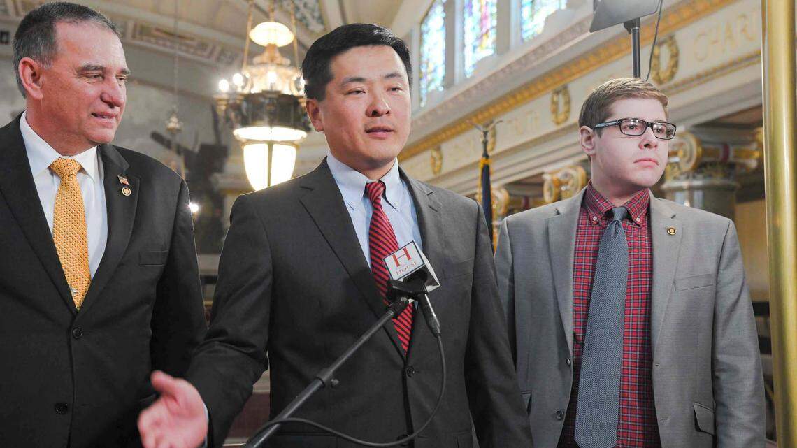 Missouri House Majority Leader Jonathan Patterson, center, talks with reporters during the 2024 legislative session.