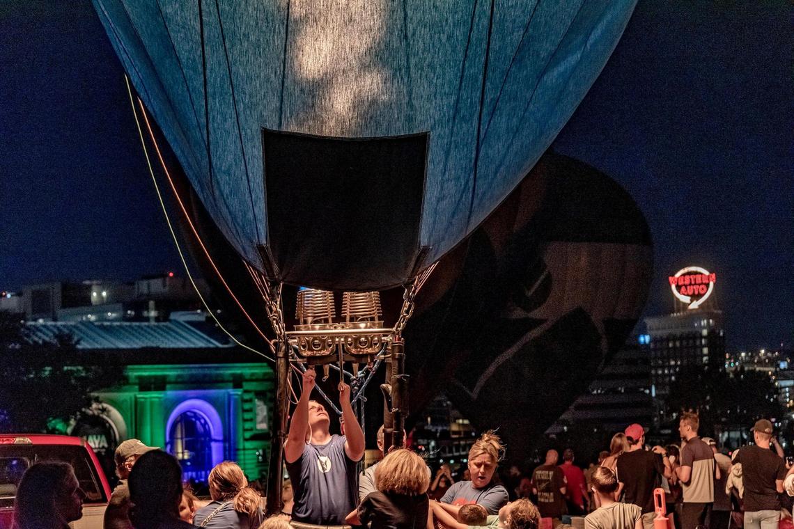 A balloon pilot fires up his burner to make his balloon glow at the Great Balloon Glow Saturday, August 20, 2022, at the National World War I Museum and Memorial.