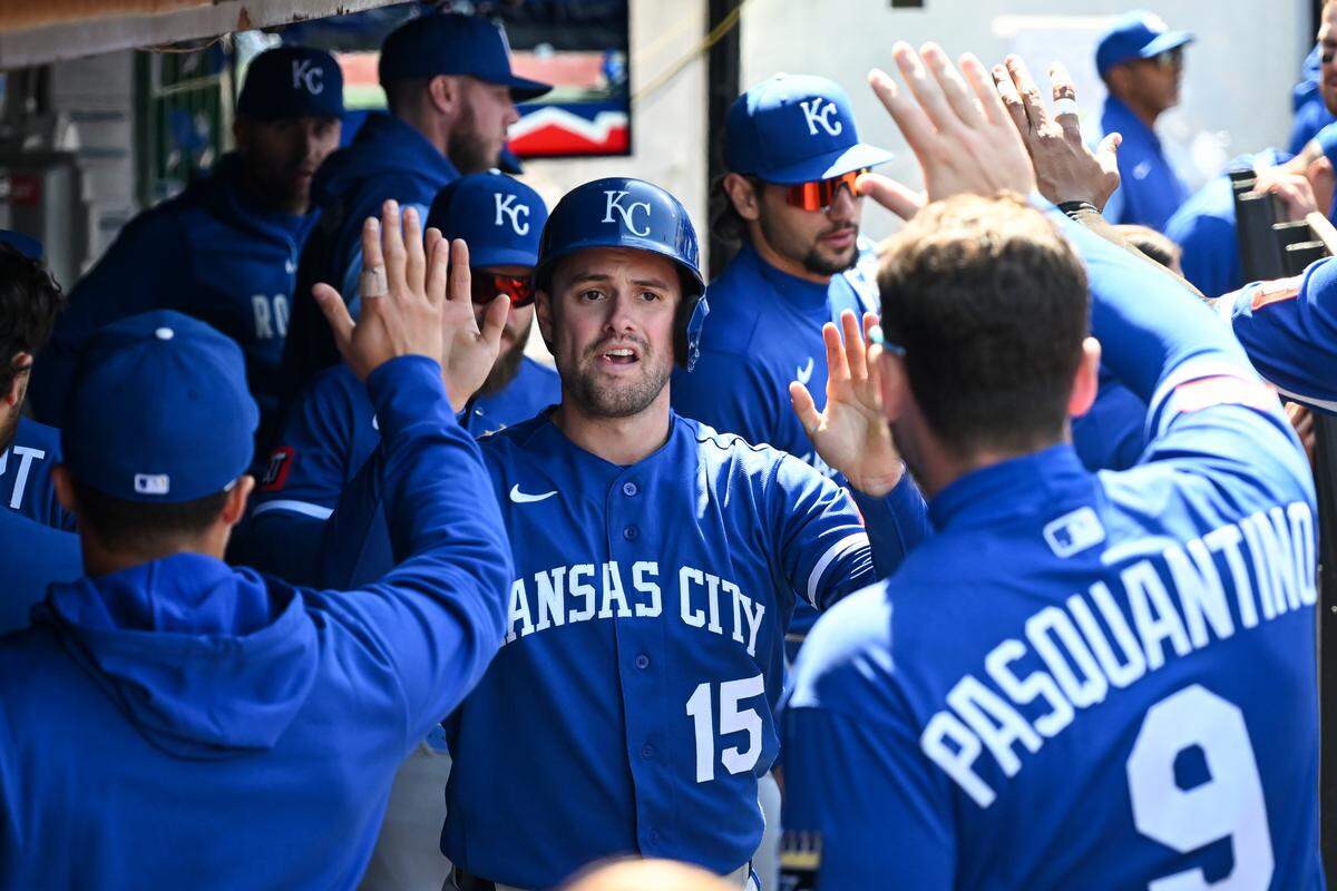 Kansas City Royals outfielder Lane Thomas (#15) celebrates with teammates after scoring on a double hit by Starling Marte during the fifth inning against the Cleveland Guardians at Progressive Field on April 08, 2026 in Cleveland, Ohio.