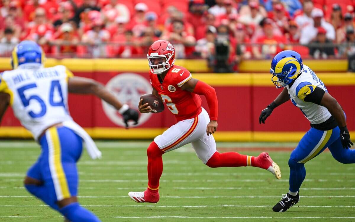 Kansas City Chiefs quarterback Justin Fields (6) looks to evade defenders in the first quarter of the Kansas City Chiefs vs. Los Angeles Rams preseason game at Arrowhead Stadium in Kansas City on Aug. 15, 2026.
