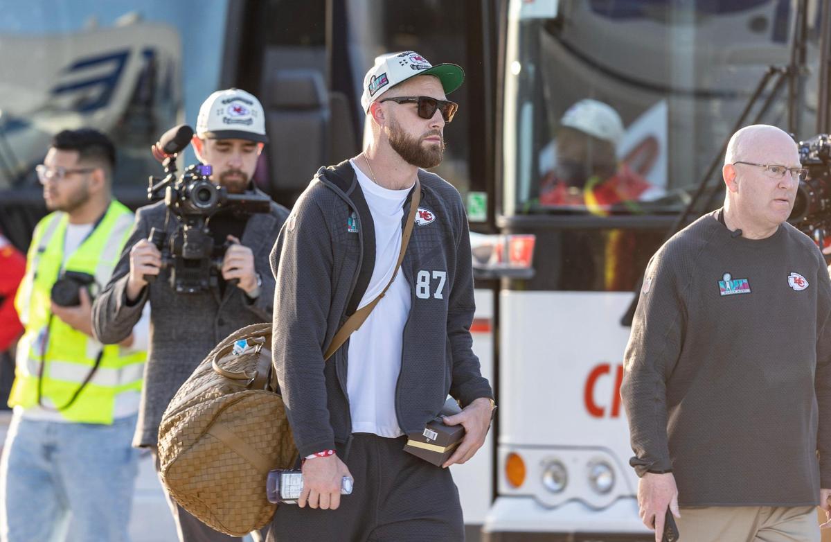 Chiefs tight end Travis Kielce boards a charter bus after the team arrived back home in Kansas City on Monday. The Kansas City Chiefs returned home after defeating the Philadelphia Eagles in Super Bowl LVII in Glendale, Ariz.