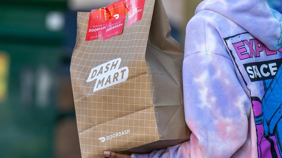 A person picks up an order from DashMart on Feb. 27 in Kansas City.