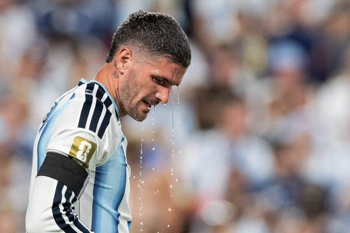 Argentina midfielder Thiago Almada (16) drips water off his head in a 2026 FIFA World Cup quarterfinal match at Kansas City (Arrowhead) Stadium in Kansas City on Saturday, July 11, 2026.