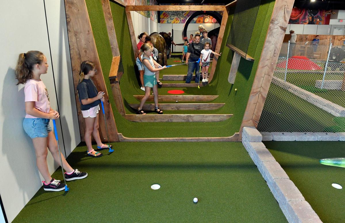 Prehistoric Putt features interactive obstacles, including an 11-foot-tall loop, zip line, pinball, ball maze race, halfpipe, warped wall, beer pong, batting cage, foosball, ski-ball, plinko, and basketball.