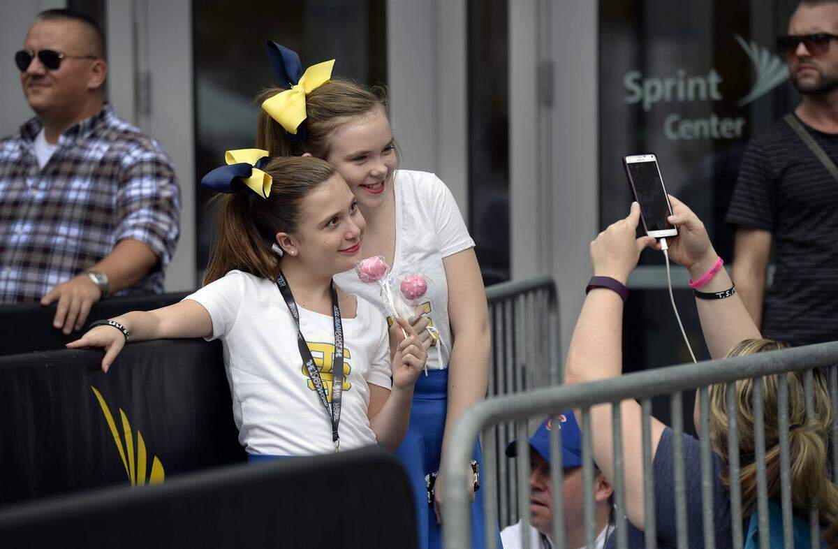 Taylor Swift fans gathered in front of the Sprint Center Sept. 21, 2015, to attend the first of Swift’s two shows in Kansas City. Olivia Morris (left), 12, and Riley Atkinson, 12, both of Overland Park, posed for a picture before the show that was taken by Amanda Morris, Olivia’s mother.