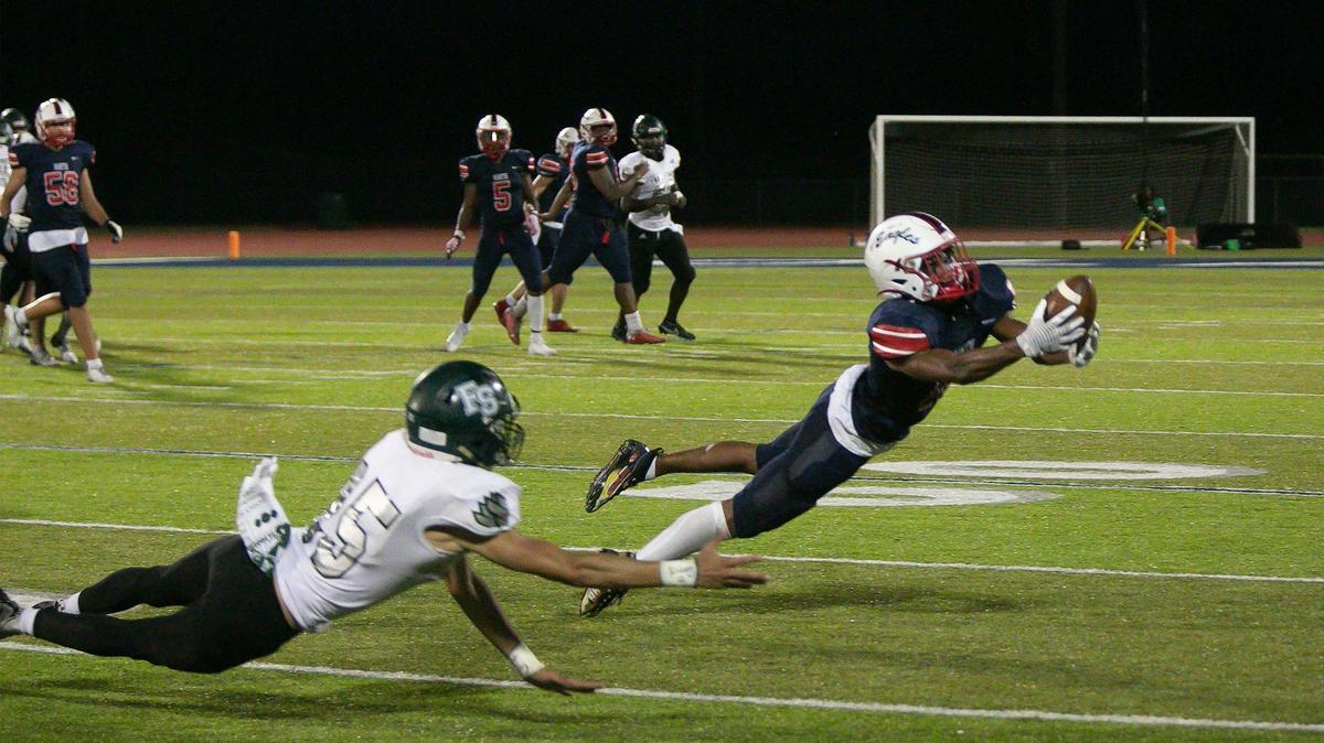 Olathe North’s #10, Jacob Parrish caught a long pass during the game against Lawrence Free State Friday, September 17, 2021 at the Olathe District Activities Center.