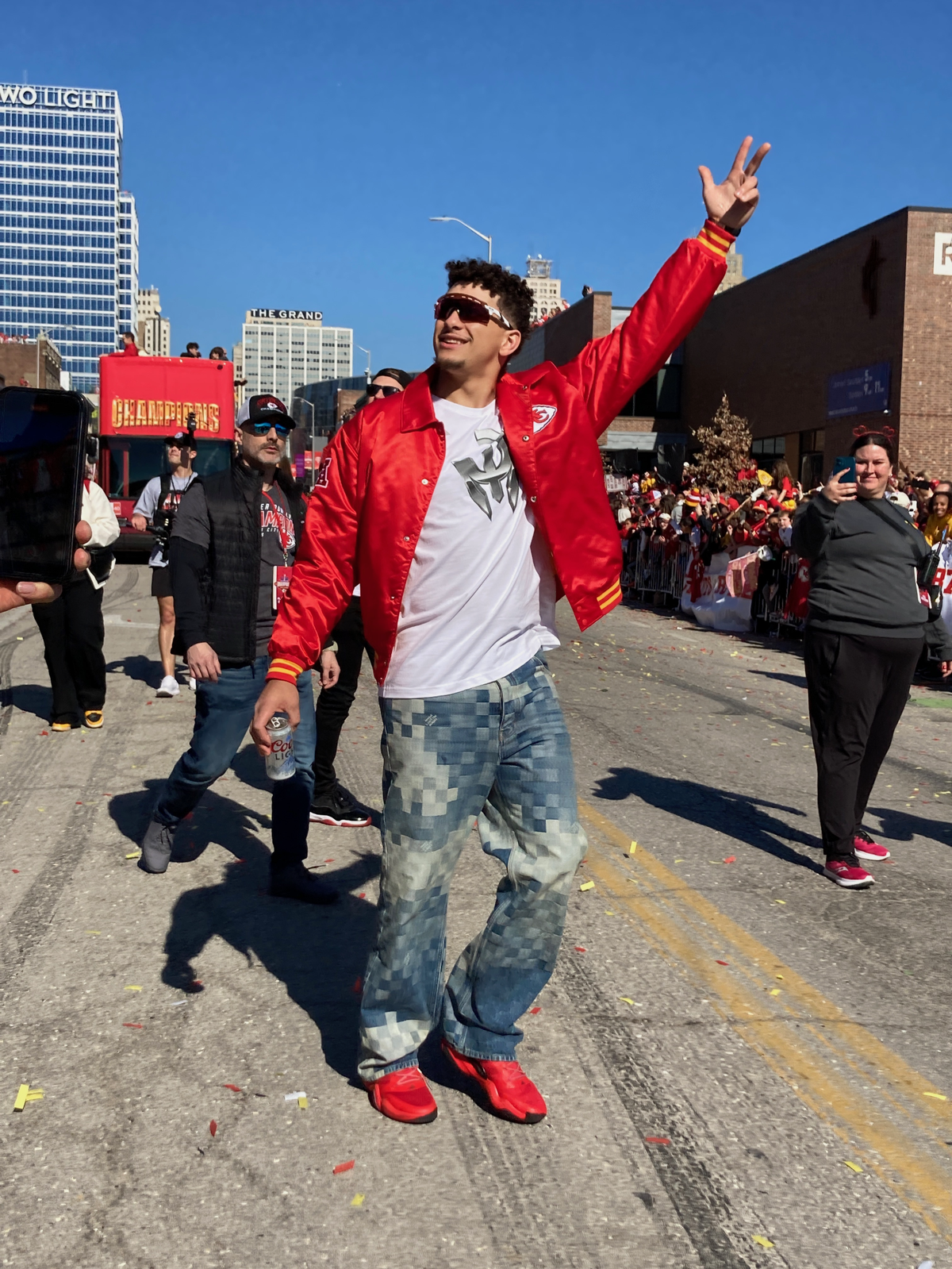 Chiefs quarterback Patrick Mahomes celebrates with fans along the Super Bowl victory parade route in Kansas City on Wednesday, Feb. 14, 2024.