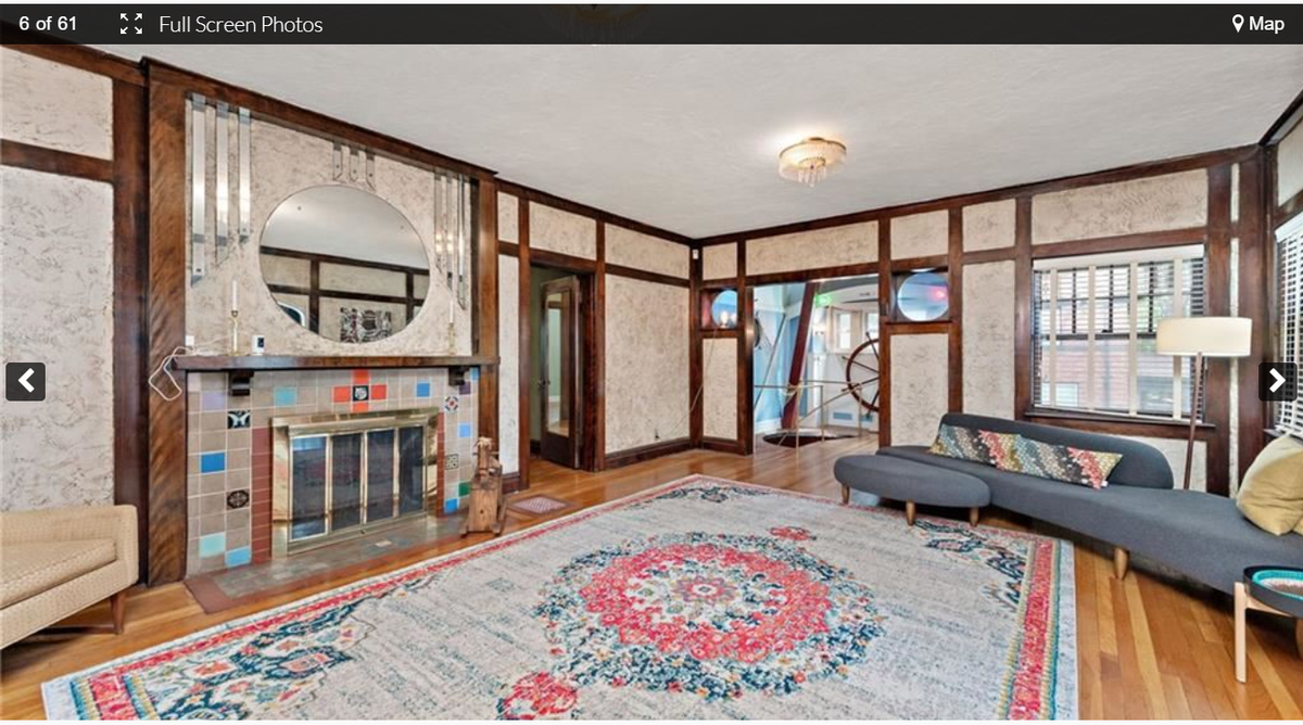 The living room looks onto the ship room at 3232 Windsor Ave. This historic home near the Kansas City Museum in the Northeast includes an indoor pool and a ship’s wheel. Screenshot from the Kansas City Regional Association of Realtors website. Feb. 9, 2024.