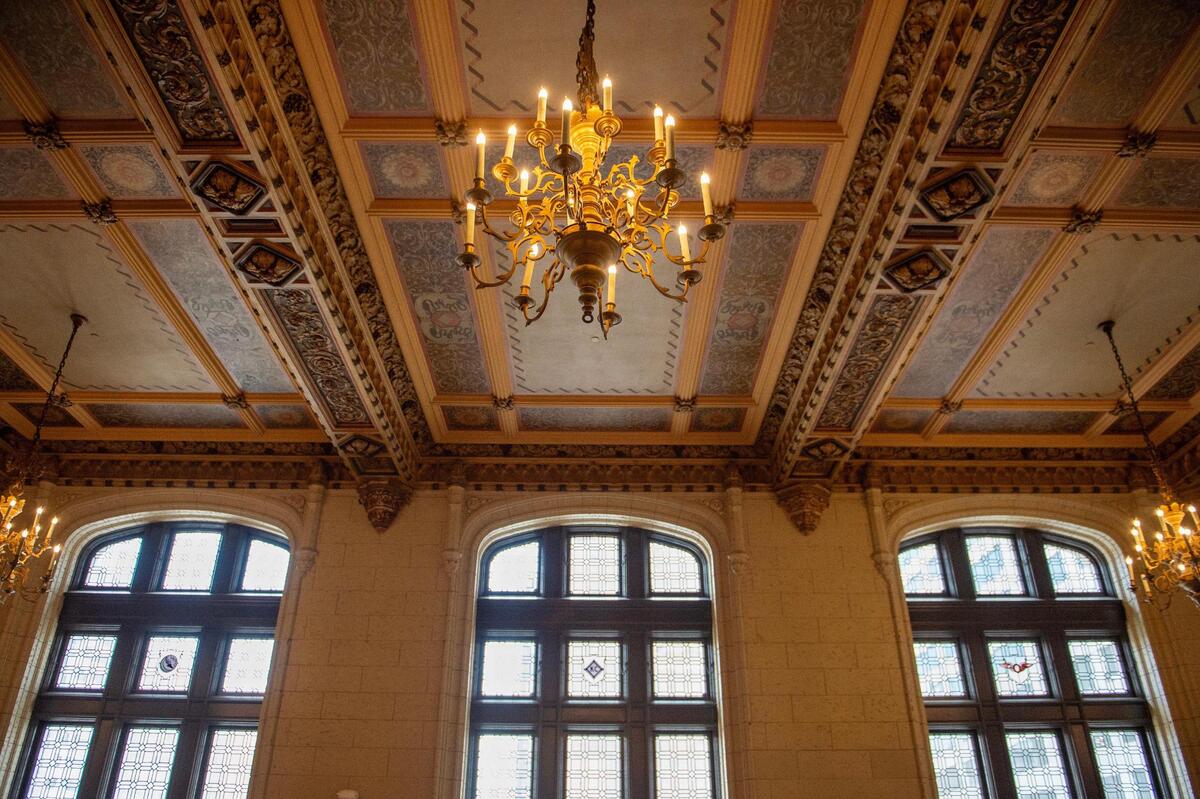 The building’s fifth-floor ballroom retains its original ceiling, chandeliers, lead glass windows and floors.