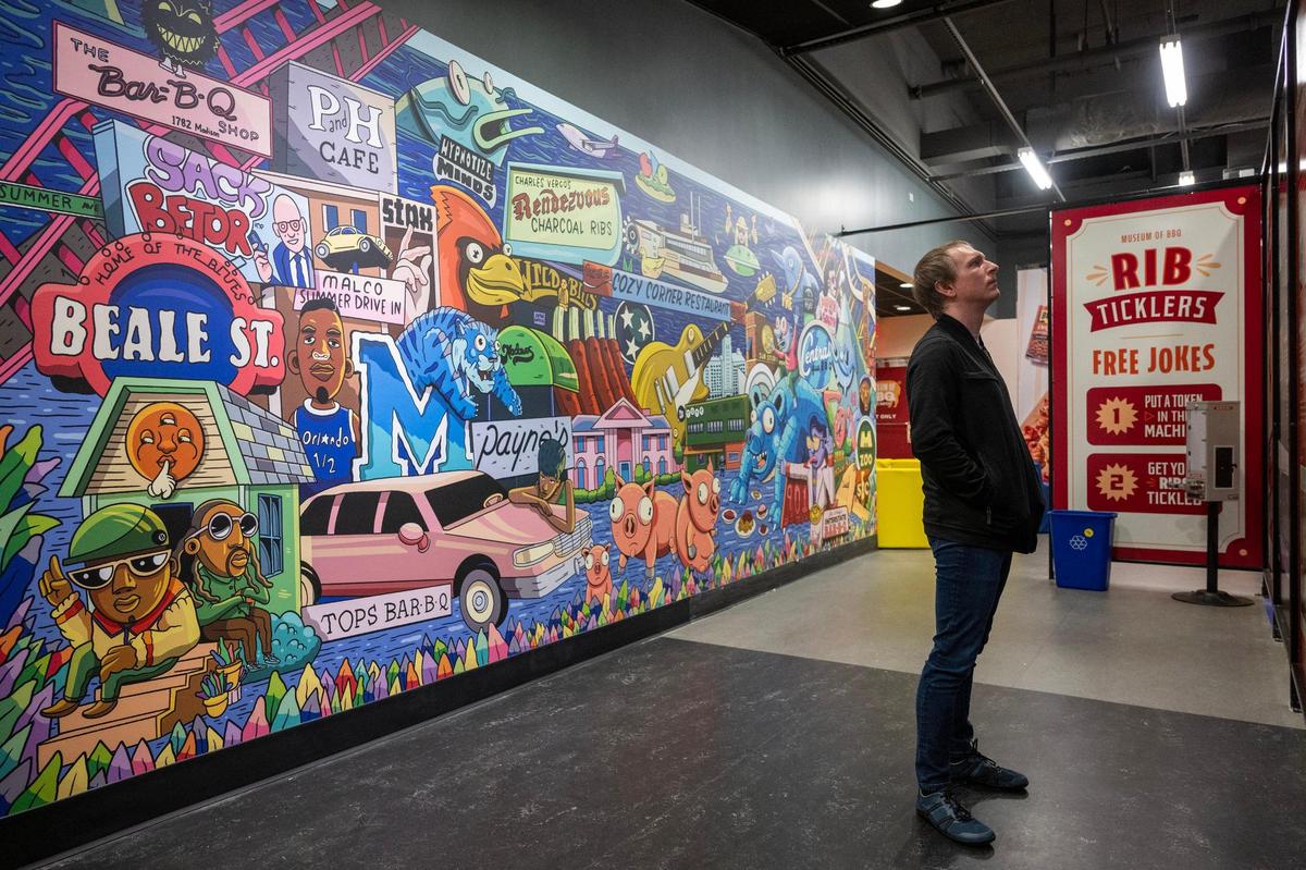 Jak Gerome of VisitKC, views an exhibit at the new Museum of BBQ during a family and friends on Wednesday, April 9, 2025, in Kansas City.