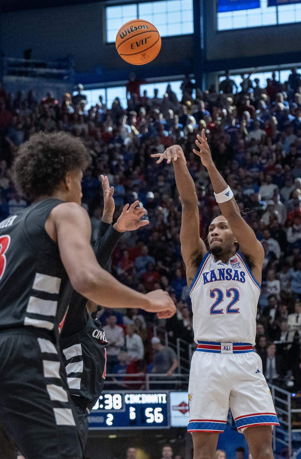 Kansas Jayhawks guard Darryn Peterson (22) shoots a three against the Cincinnati Bearcats in the second half Allen Fieldhouse on Saturday, Feb. 21, 2026, in Lawrence, Kansas.