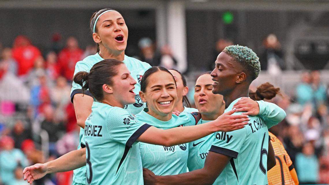 Kansas City Current midfielder Lo’eau LaBonta (center) celebrates with her teammates after scoring a goal on a penalty kick against the Houston Dash in the first half at CPKC Stadium on April 19, 2025.