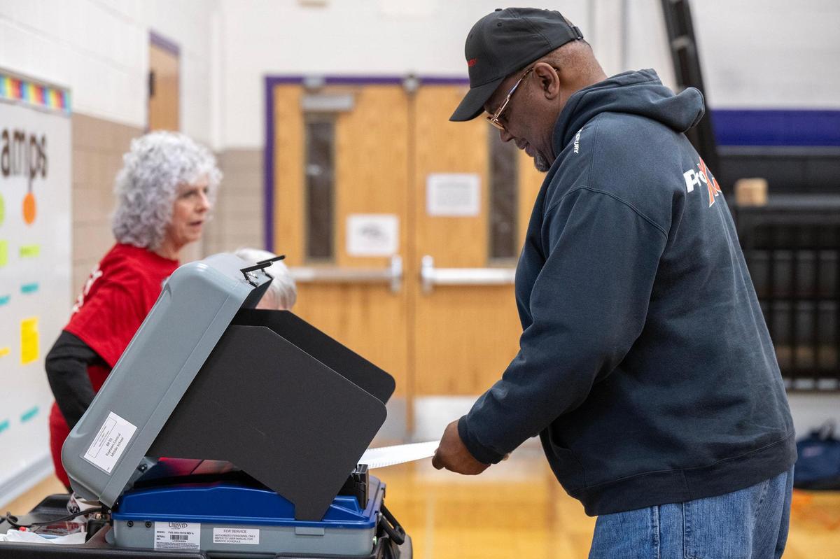 Raytown resident Michael Carter cast his ballot after voting Tuesday, April 2, 2024, at Raytown Central Middle School. Jackson County voters went to the polls to decide on many races but most notably Question 1, which would authorize tax funding to help pay for a new Royals stadium in the Crossroads and renovations to Arrowhead Stadium.