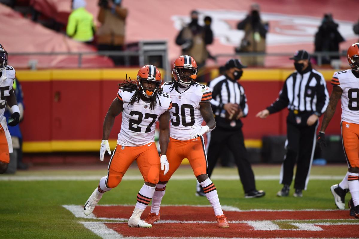 Cleveland Browns running back Kareem Hunt (27) celebrated a 3-yard touchdown run with running back D’Ernest Johnson in the second-half of game against Kansas City during the AFC divisional playoff game Sunday, Jan. 17, 2021 at Arrowhead Stadium. The Chiefs held on to win, 22-17.