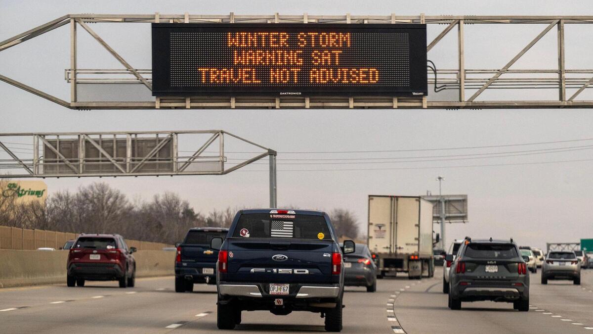 Highway signs along Interstate 435 in Johnson County alert drivers to the impending winter storm on Friday in Overland Park as an approaching snowstorm could bring several inches of snow along with gusty winds that could make travel dangerous.