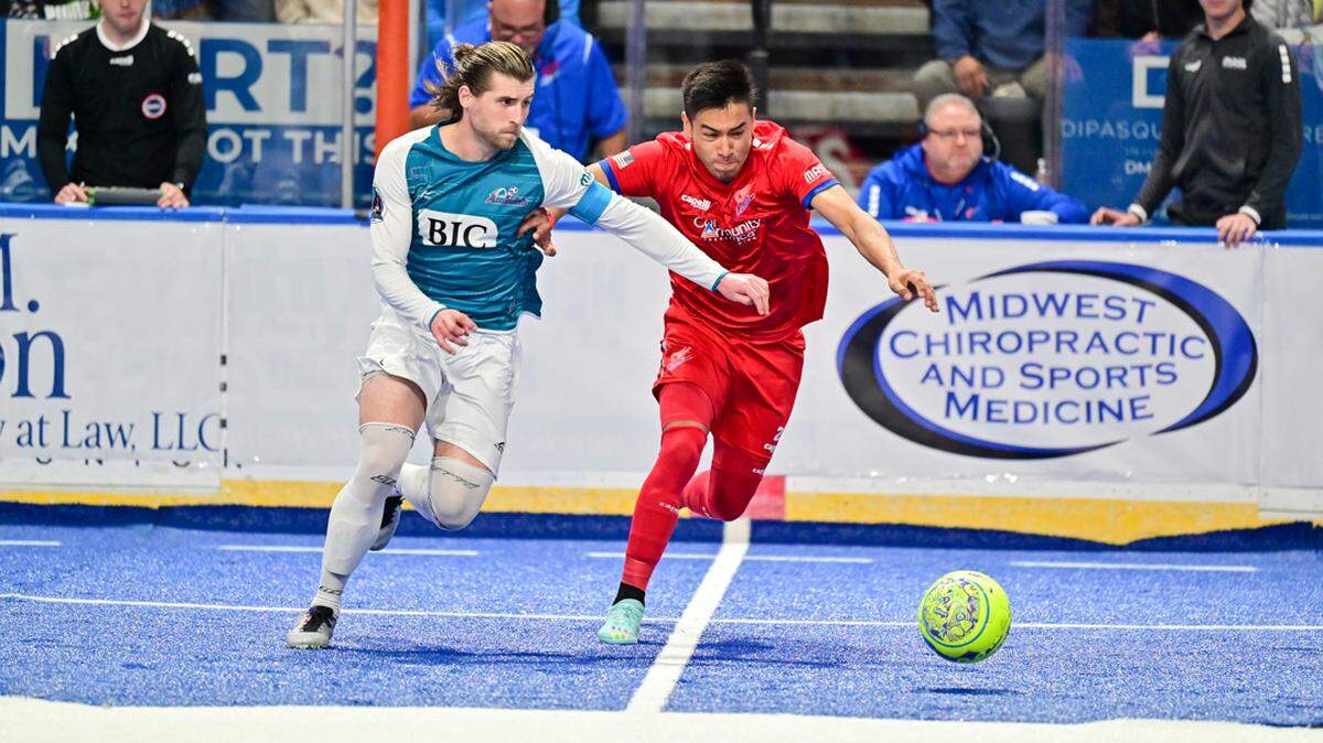 Kansas City Comets player Lalo Alonso right chases down a ball alongside a St. Louis Ambush player during a recent match.