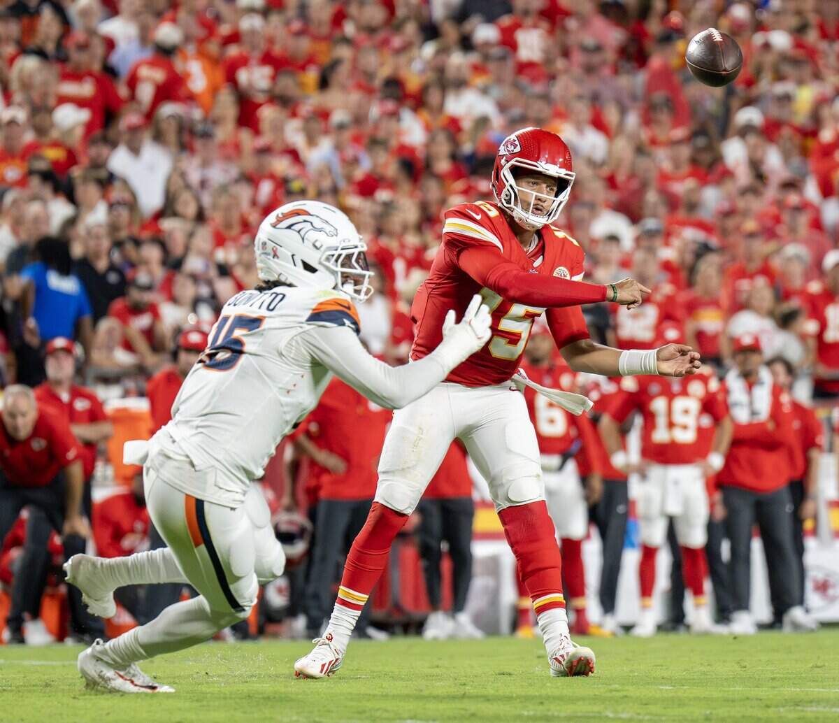 Kansas City Chiefs quarterback Patrick Mahomes (15) throws a pass in the second quarter during the the season opener against the Denver Broncos at Arrowhead Stadium on Monday, Sept. 14, 2026, in Kansas City.