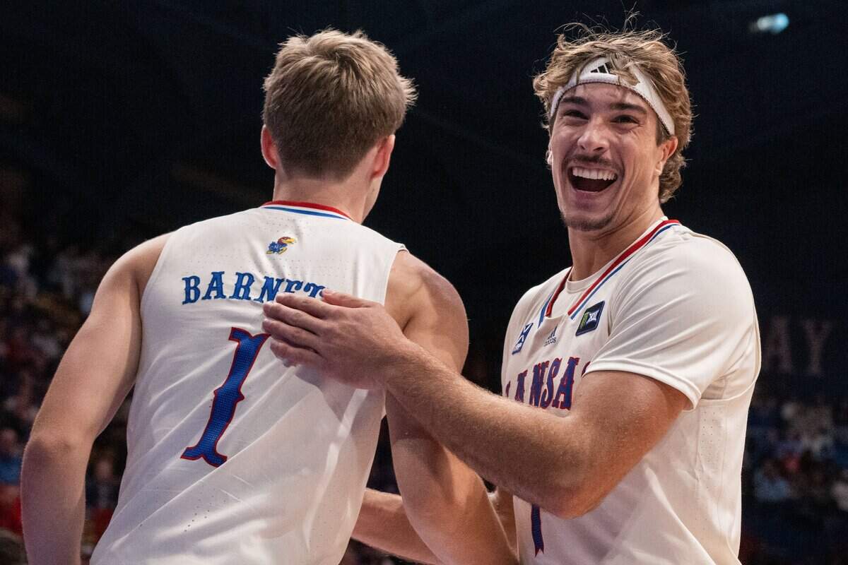 Kansas Jayhawks guard Kohl Rosario celebrates with guard Luke Barnett in the Jayhawks exhibition game vs. Pittsburg State Gorillas, on Friday, October 16, 2026, at Allen Fieldhouse. The exhibition game, a first for Late Night in the Phog, replaces the normal format of variety show style sketches and a team scrimmage.