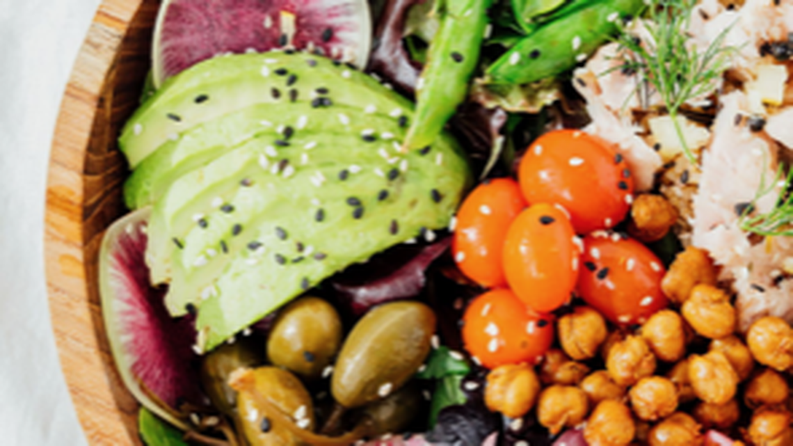 Billie’s Grocery’s tuna bowl with organic greens, pickled onions, crispy chickpea, roasted tomato, caper berries, charred sugar snap peas and a brown rice-quinoa blend with Billie’s maple balsamic glaze.